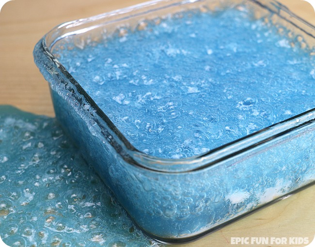 Make a bubbling slime science sensory tub that bubbles for hours and hours! Such a fun way to observe the baking soda and vinegar reaction.