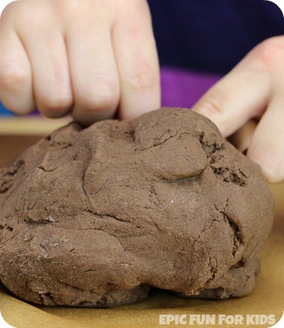 This chocolate slime play dough is wobbly and slimy, but holds it shape surprisingly well, making it perfect for building and squishing!